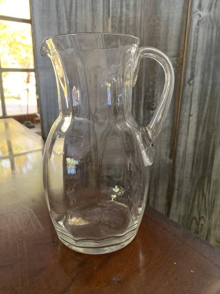 Transparent glass pitcher Mid-Century (1960s) — Czech Republic, bulbous silhouette and integrated handle.