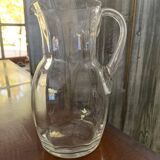 Transparent glass pitcher Mid-Century (1960s) — Czech Republic, bulbous silhouette and integrated handle.
