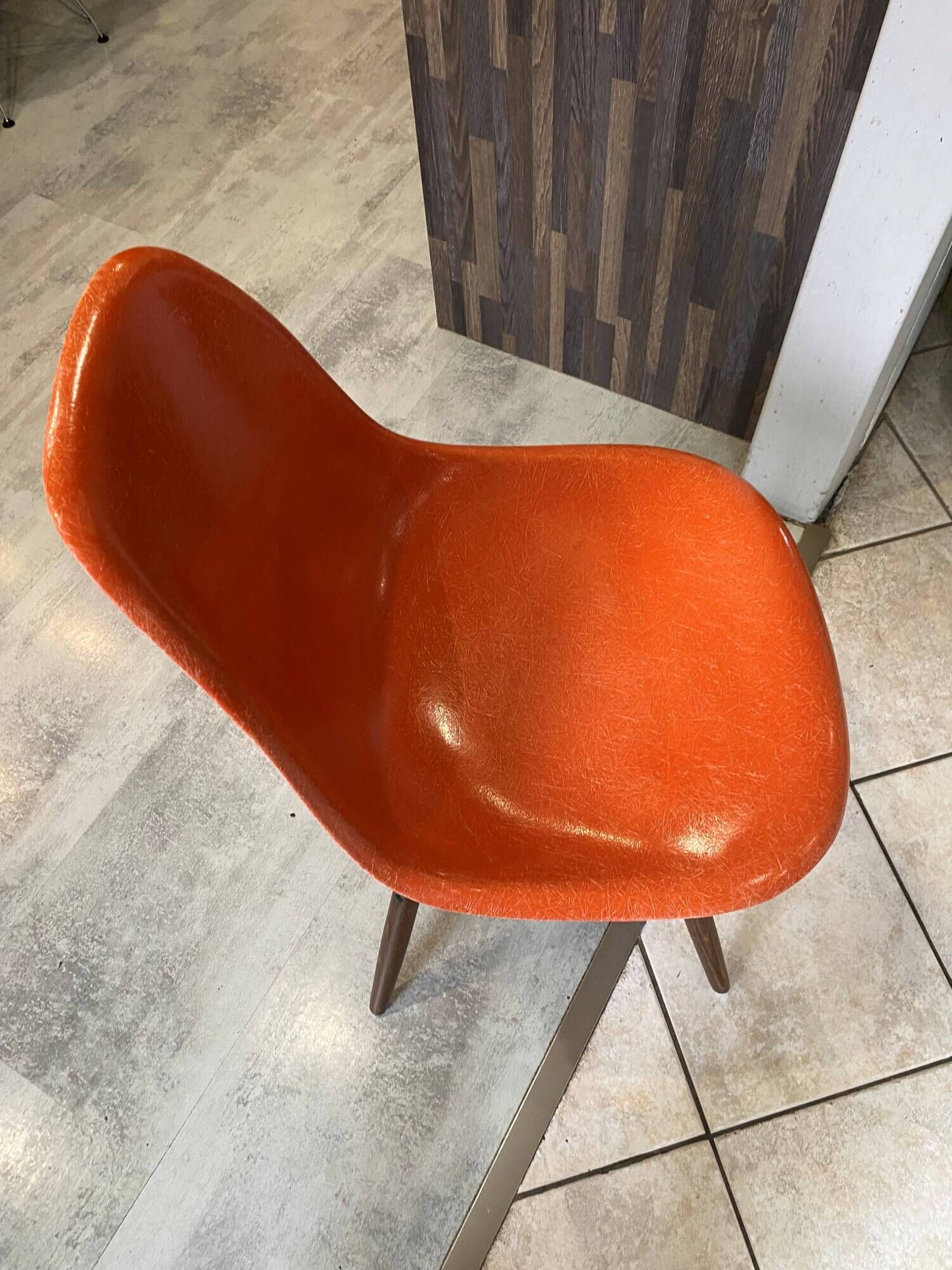 A vintage 70s Eames Herman Miller DSW Fiber Red Orange Dowel Walnut Chair