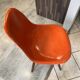 A vintage 70s Eames Herman Miller DSW Fiber Red Orange Dowel Walnut Chair