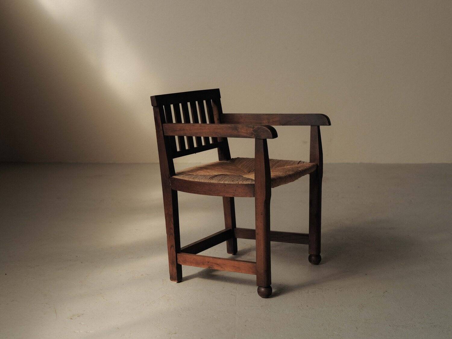 Handcrafted oak and straw armchair, France, circa 1950.