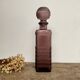 Plum glass bottle