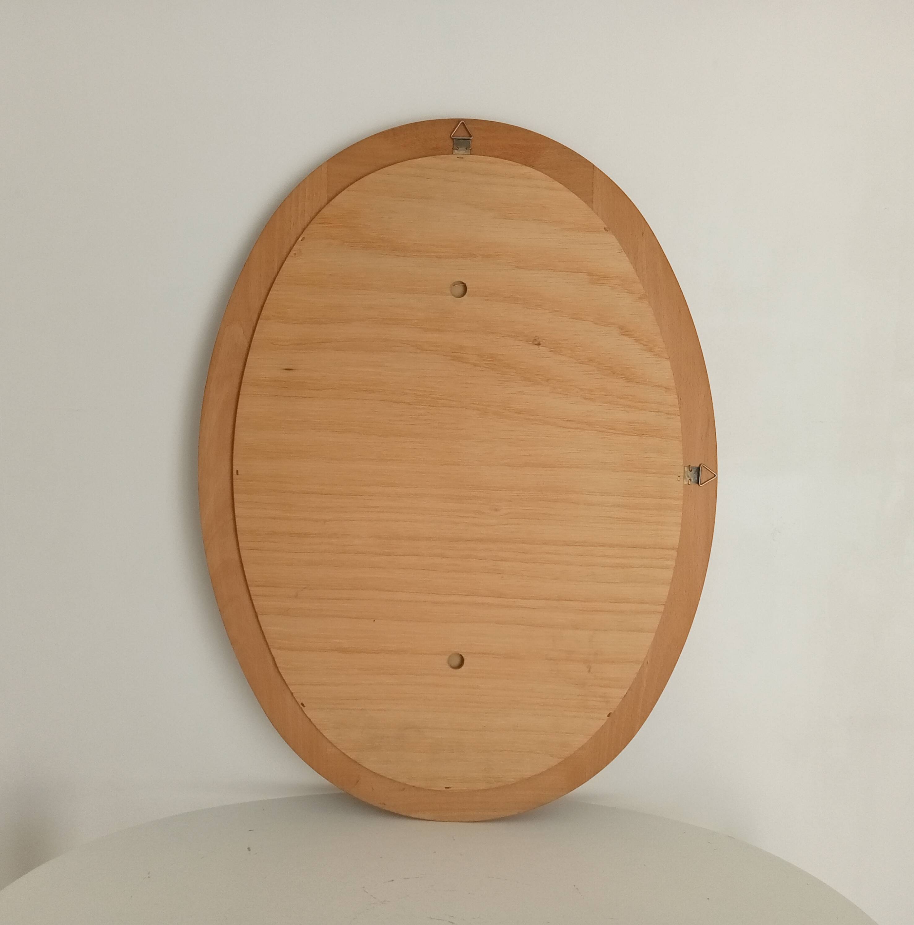 Vintage oval mirror in beech from the 70s/80s.