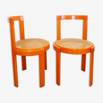 Pair of vintage 1970 orange stain wooden chairs and seat caning