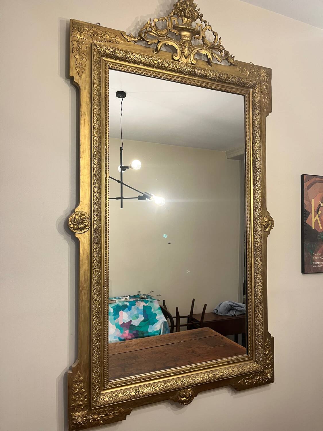 Antique Louis XVI style mirror in gilded wood