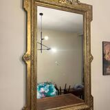 Antique Louis XVI style mirror in gilded wood