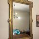 Antique Louis XVI style mirror in gilded wood