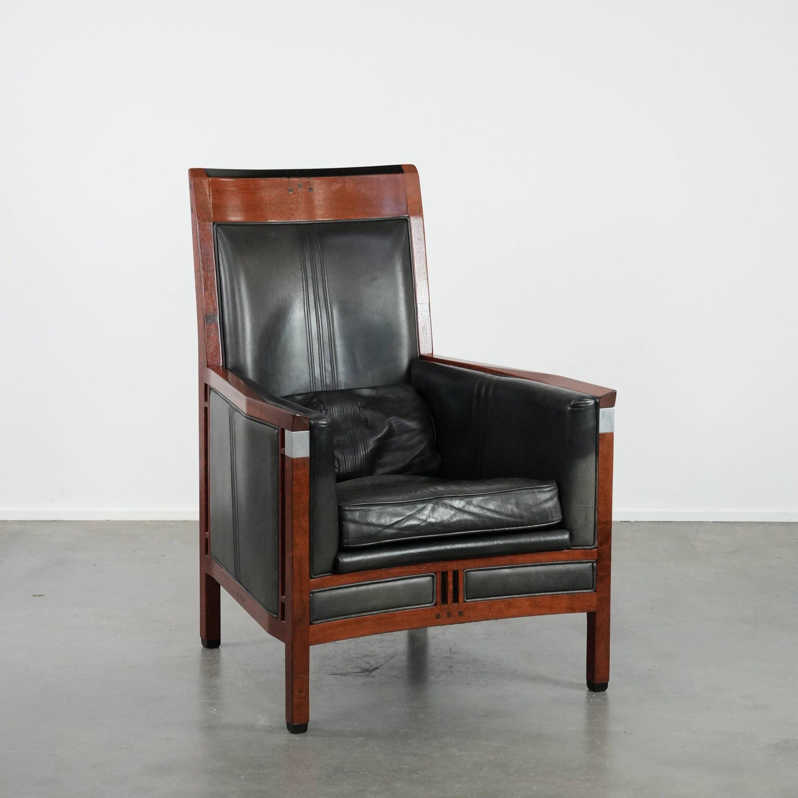 Black Art Deco cowhide leather and wooden design armchair with a high back