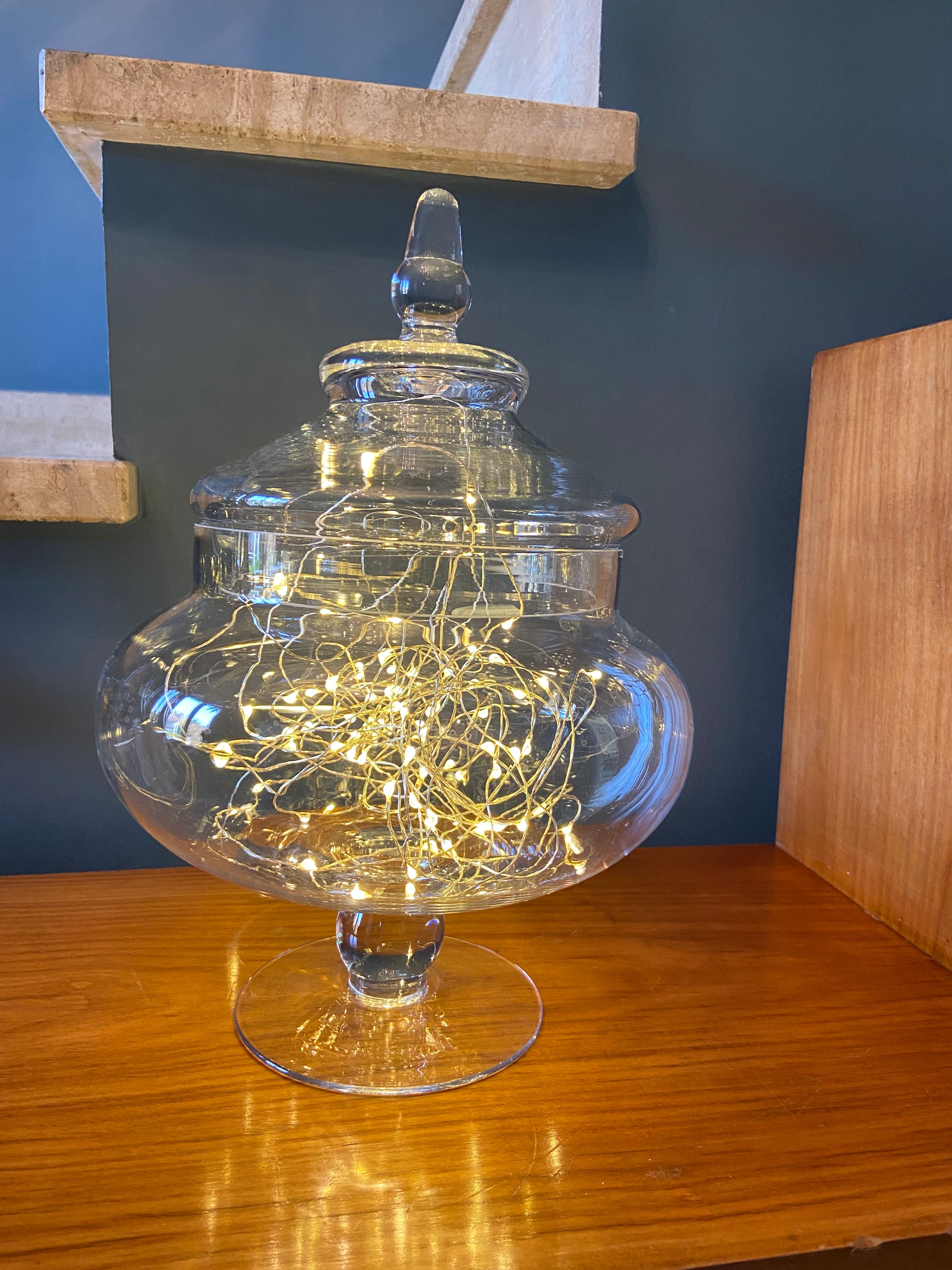 Glass jar on pedestal