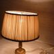 Empire style lamp in golden brass with pleated shade