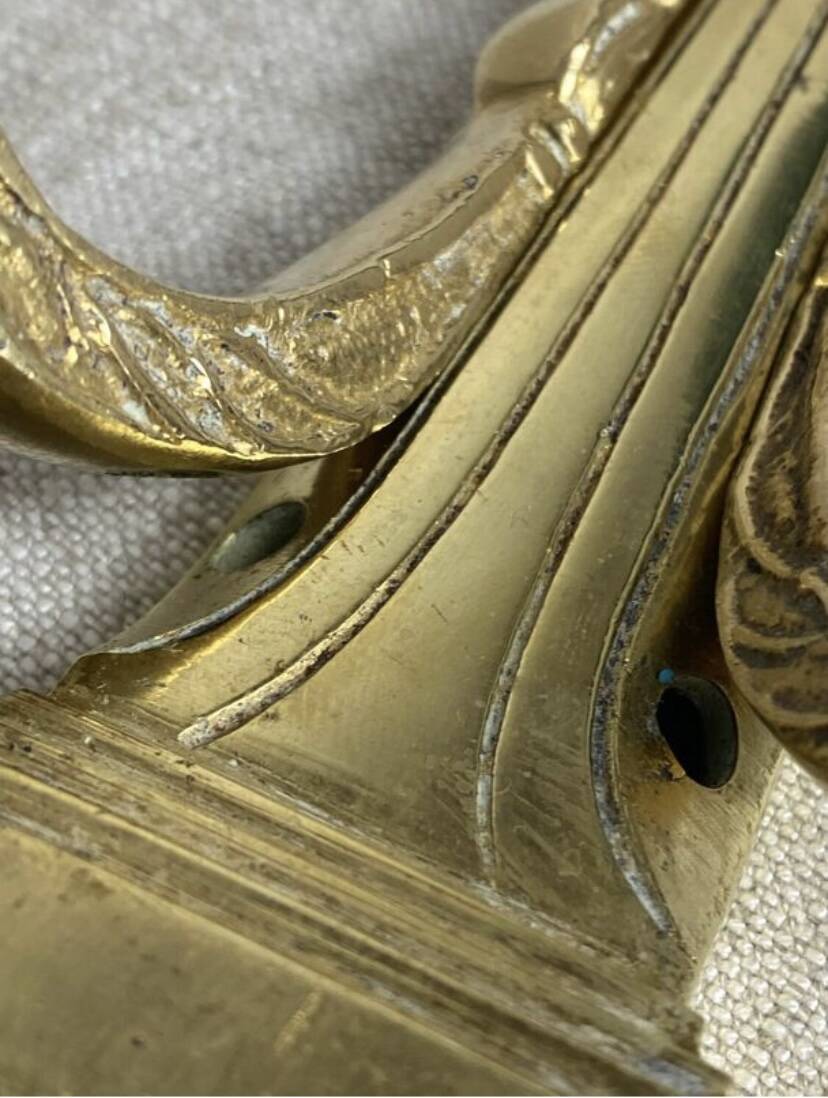 Pair of wall candle holders in bronze