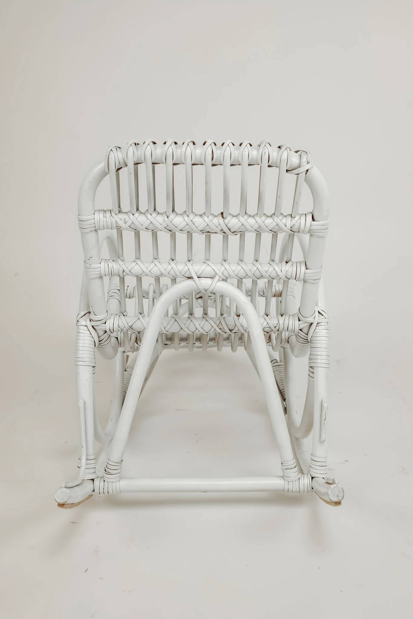 Vintage rocking chair for children in rattan/bamboo.