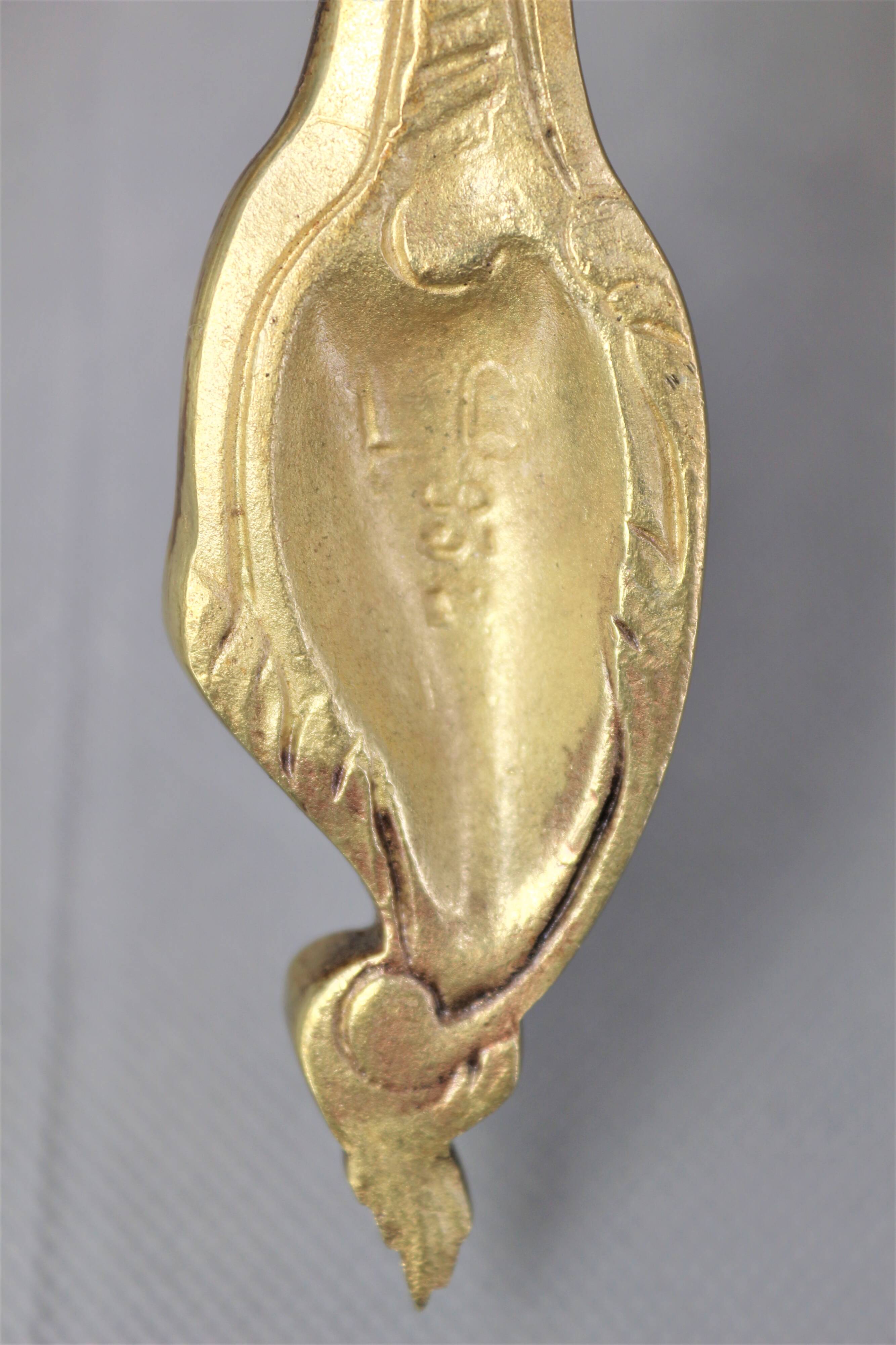 Pair of Louis XV style beveled mirror sconces in bronze by Lucien Gau