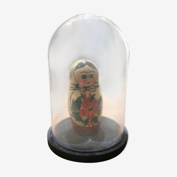 Russian doll or matryoshka under traditional bell