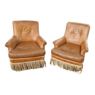 Paire fauteuils en cuir