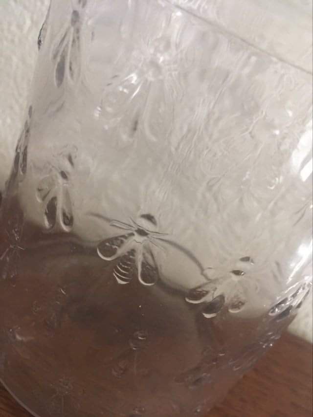 Guerlain bottle with bees.