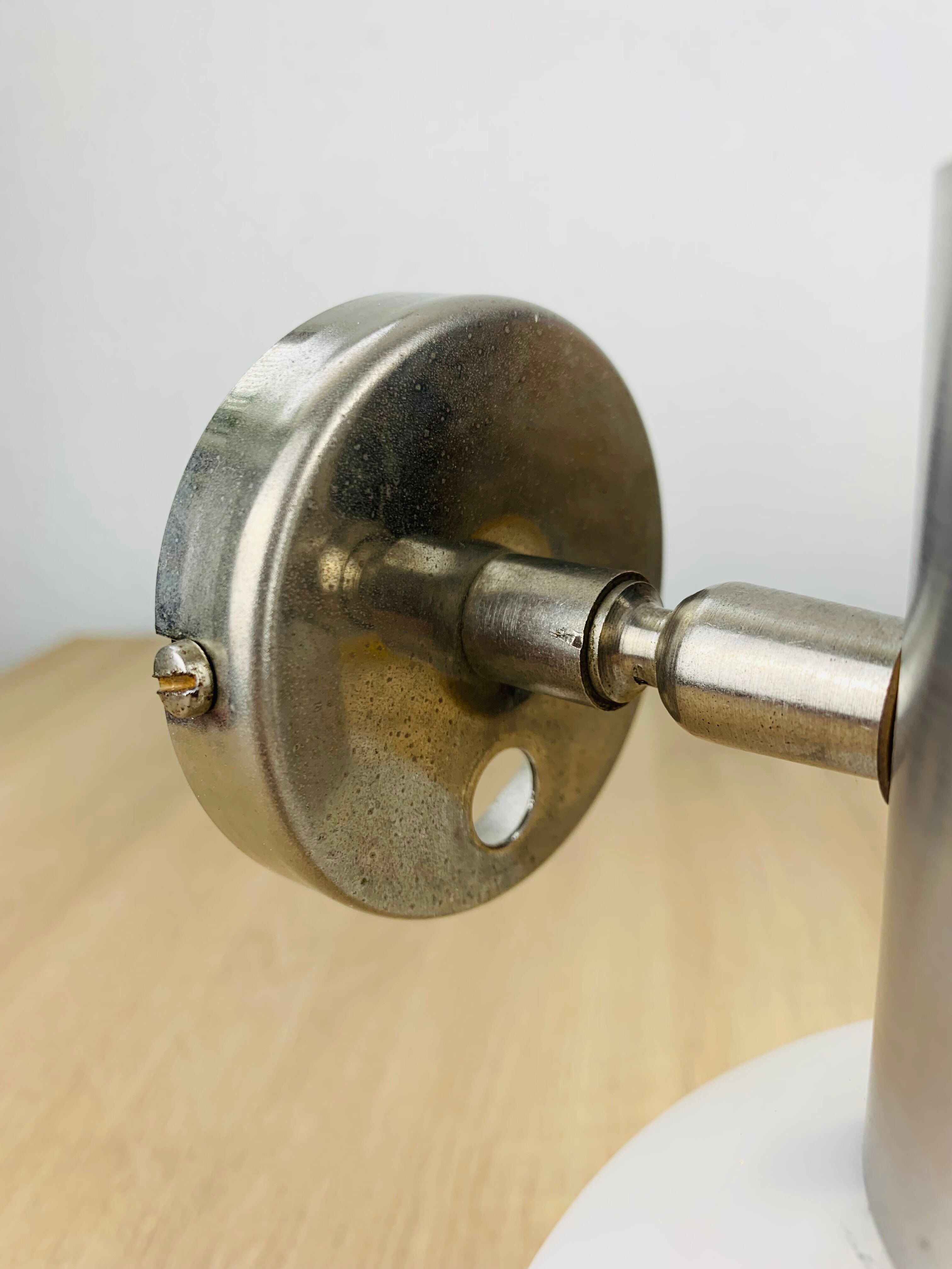 Space age opaline globe wall light, adjustable, and brushed metal, 1960s.