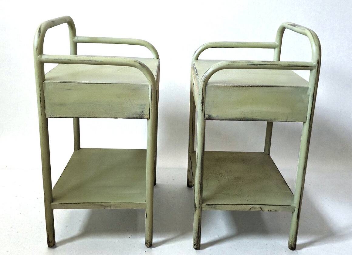 Copy of a pair of patinated metal bedside tables.