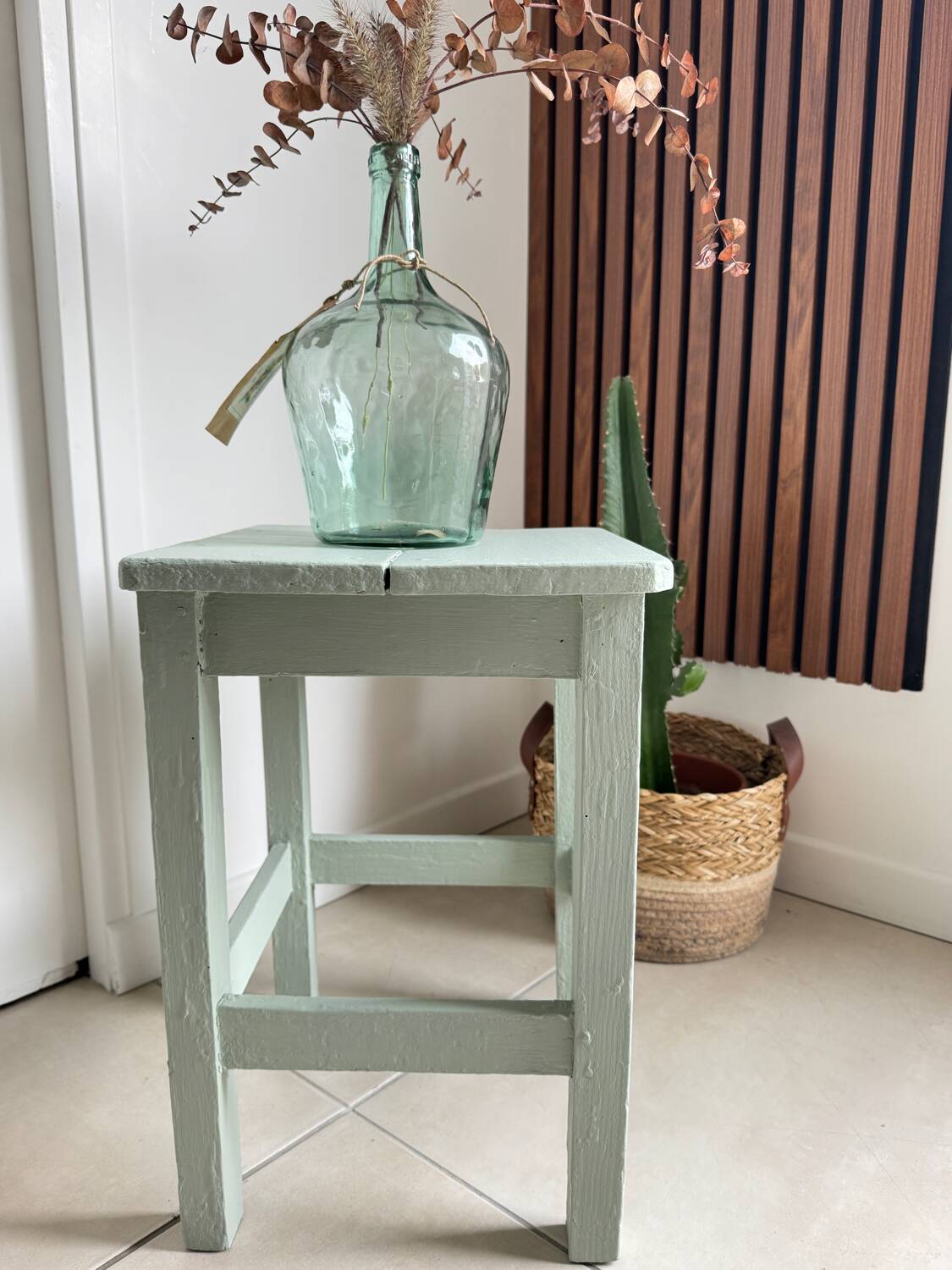 Antique almond green wooden stool