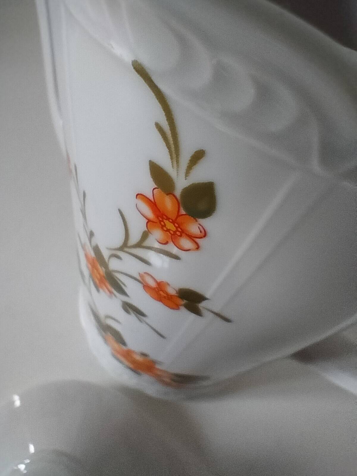 Vintage coffee pot Winterling Bavaria with orange floral decoration.