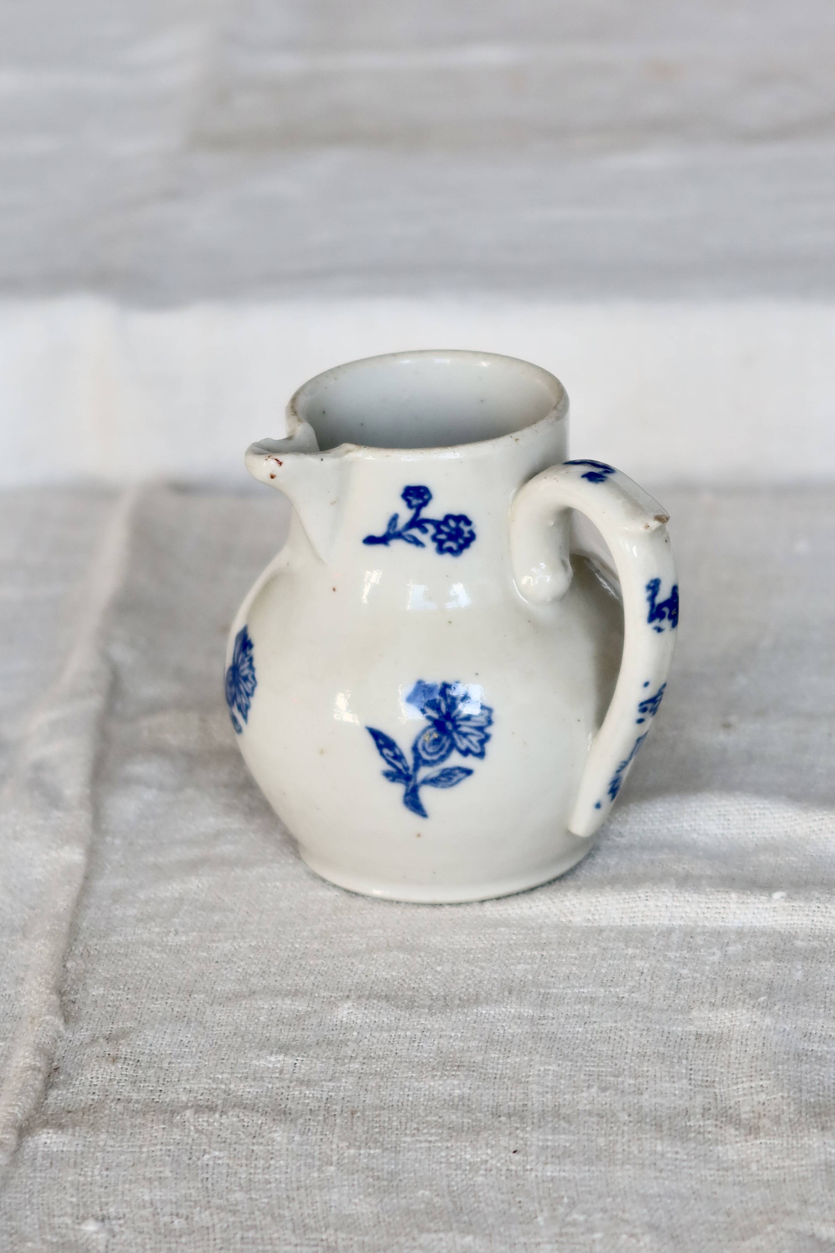 Antique Saint-Uze steel clay pitcher with cobalt blue floral pattern