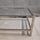 Vintage bevelled glass coffee table and lightly gilded square metal tubes from the 70s/80s