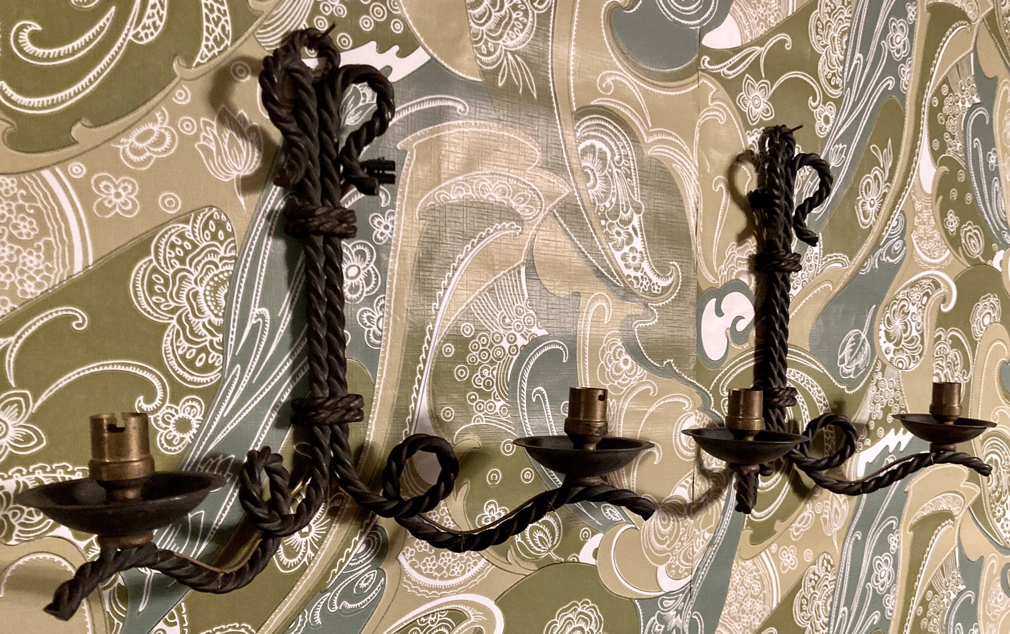 Pair of corded wrought iron wall lights