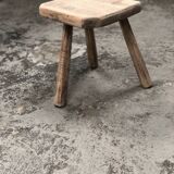 Old wooden tripod stool