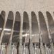 11 silver-plated metal lunch knives by Ravinet Coquille, 18cm