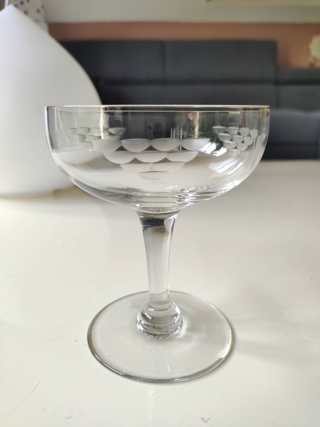 Set of 6 Baccarat-style champagne glasses. Stylized grape cluster decoration.