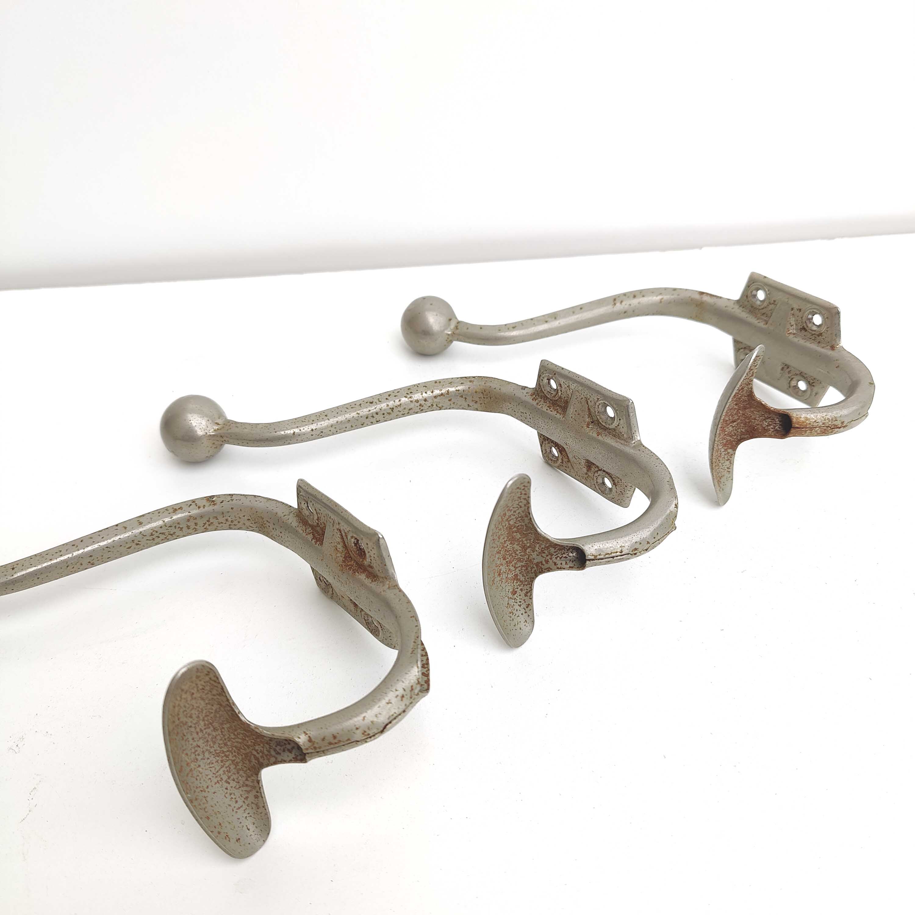 Three metal hooks
