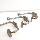 Three metal hooks
