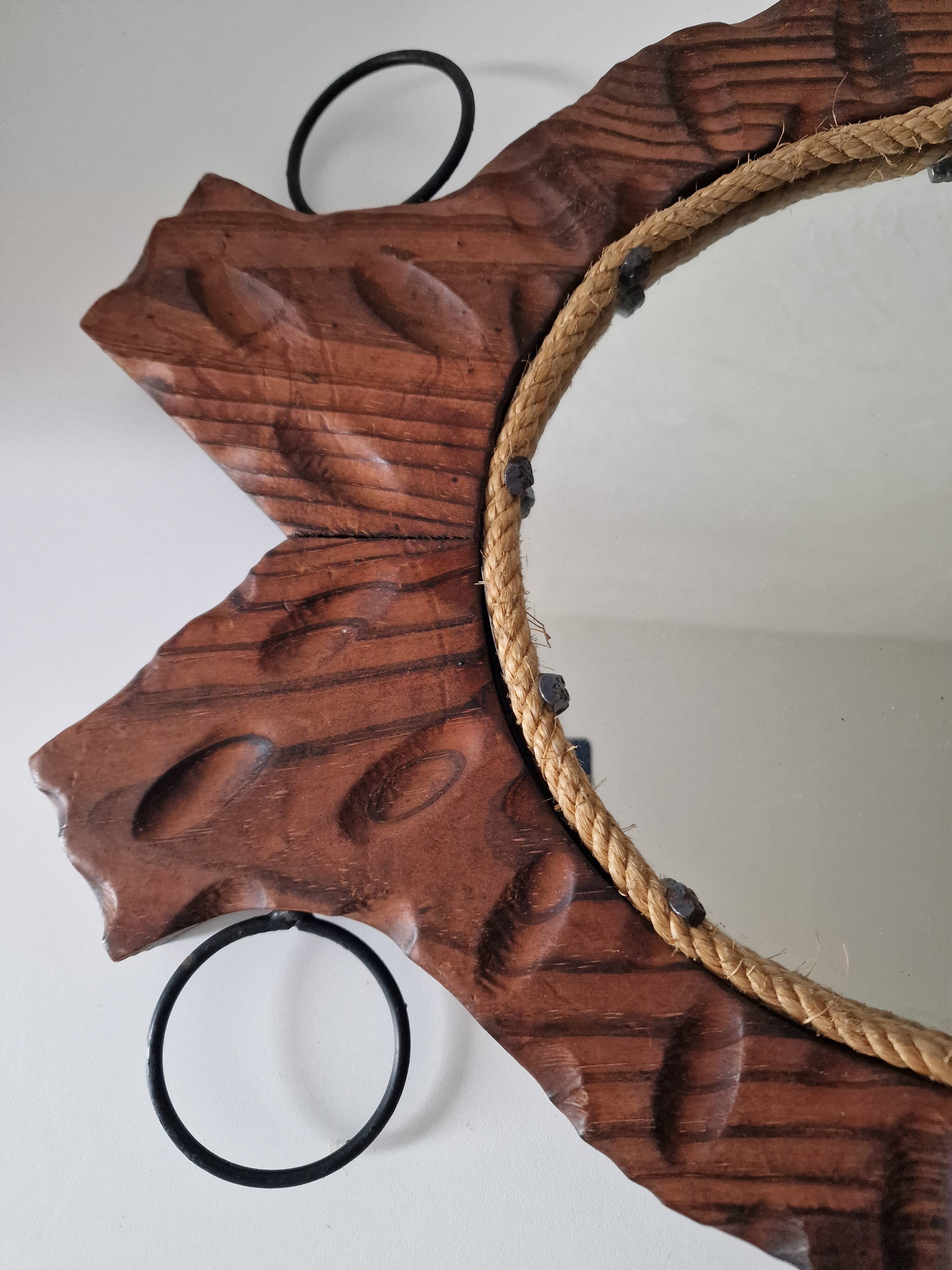 Brutalist mirror in wood and rope, free form.