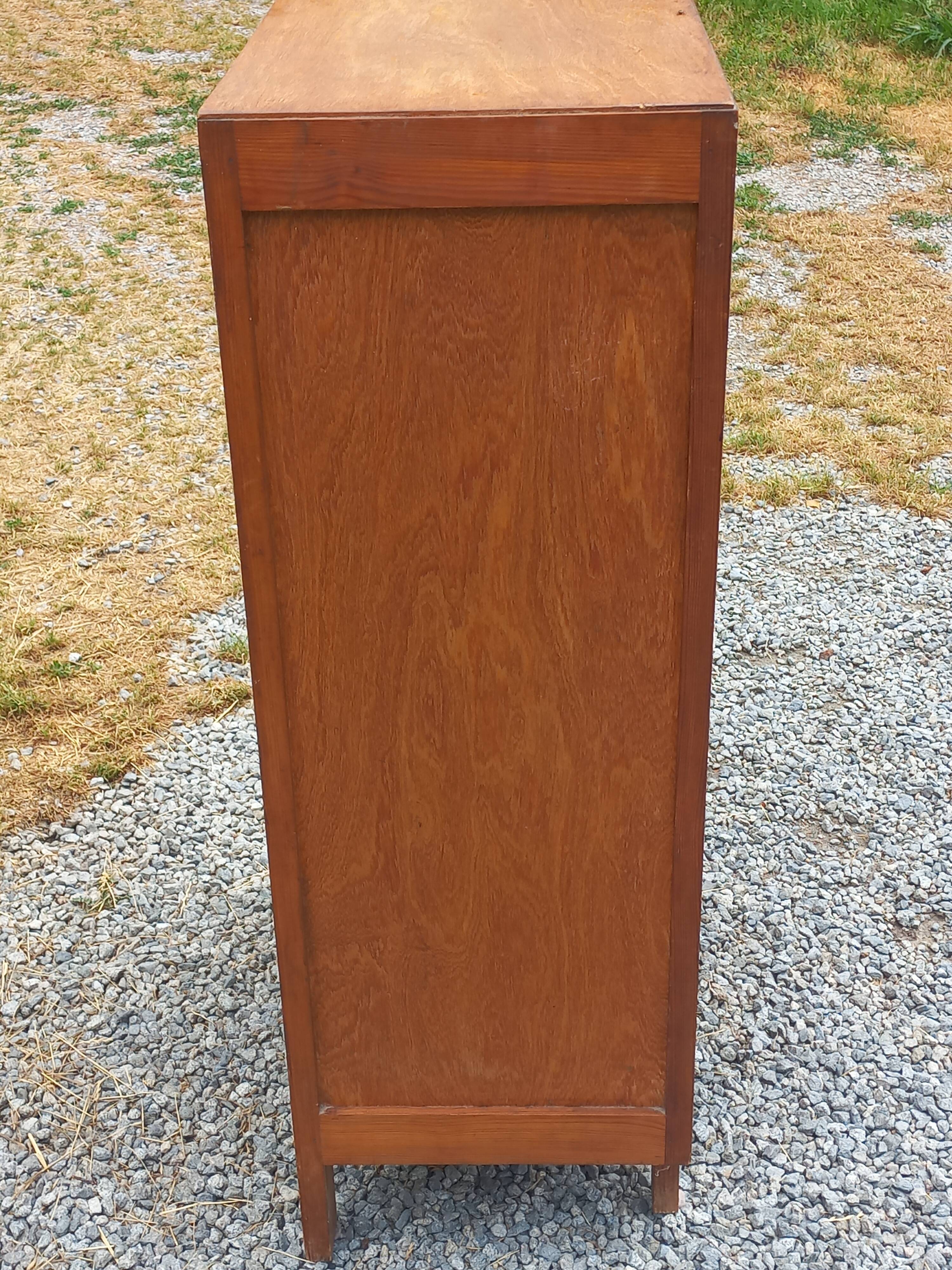 Vintage 1950s chest of drawers with tapered legs and 5 drawers.