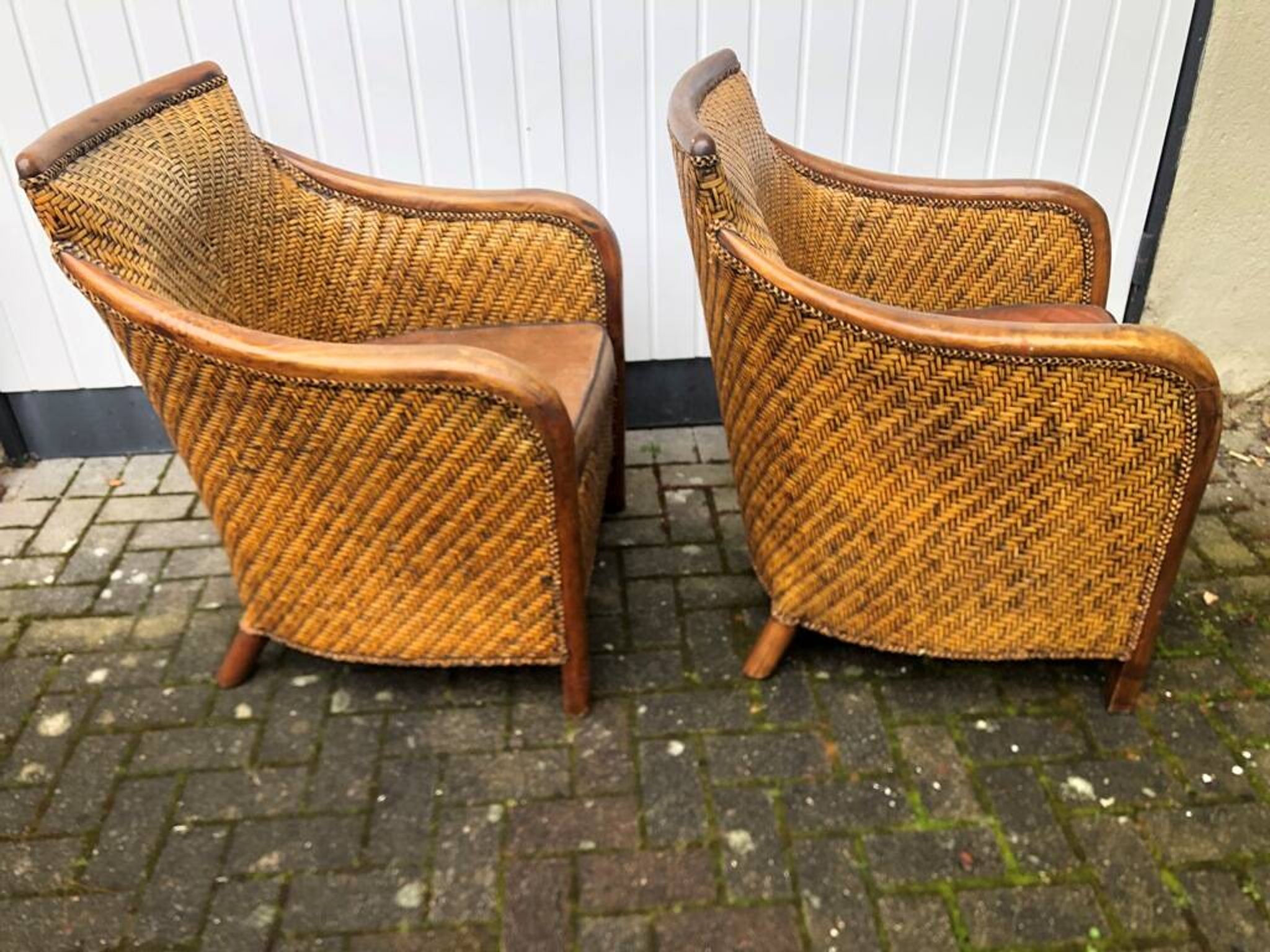2 colonial armchairs in wood, rattan and leather, 1950s