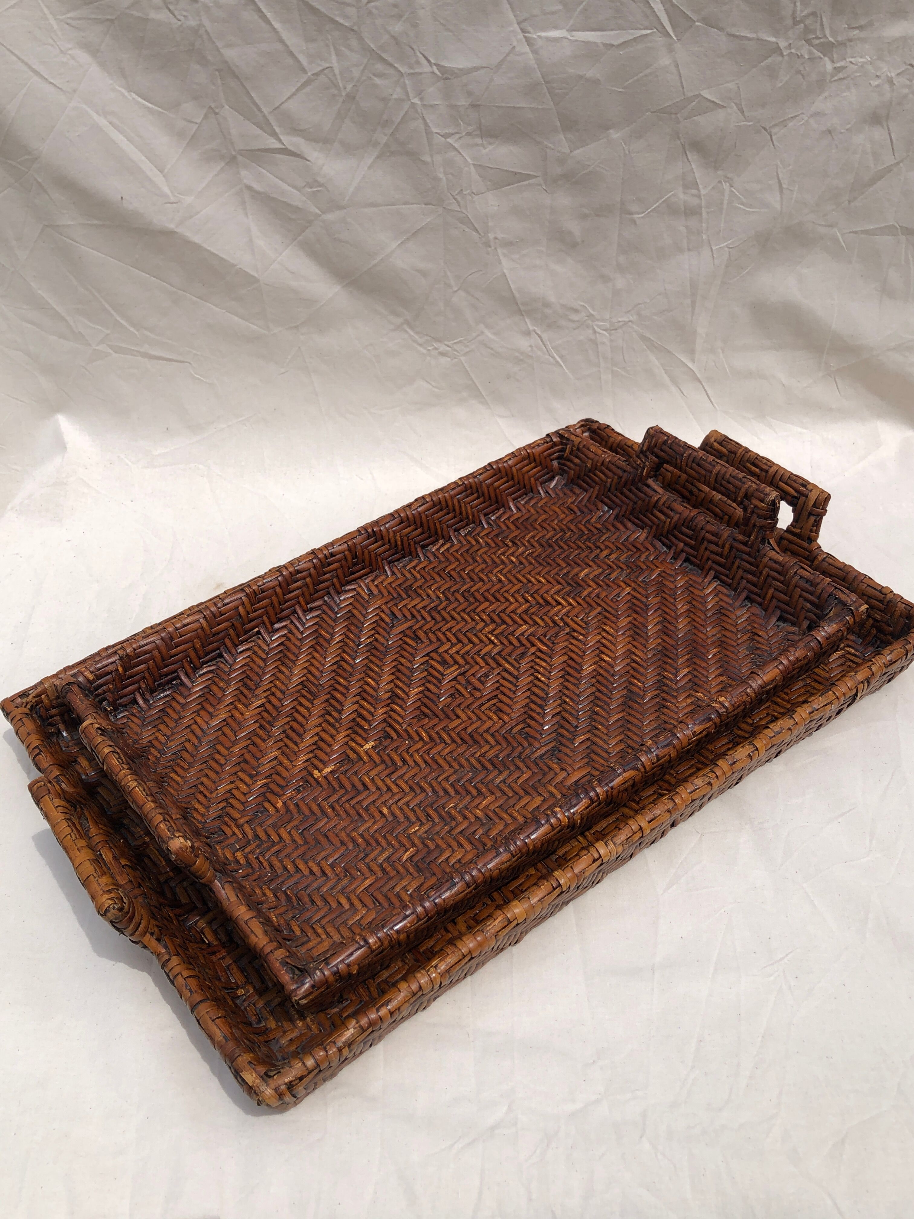 Pair of dark rattan trays
