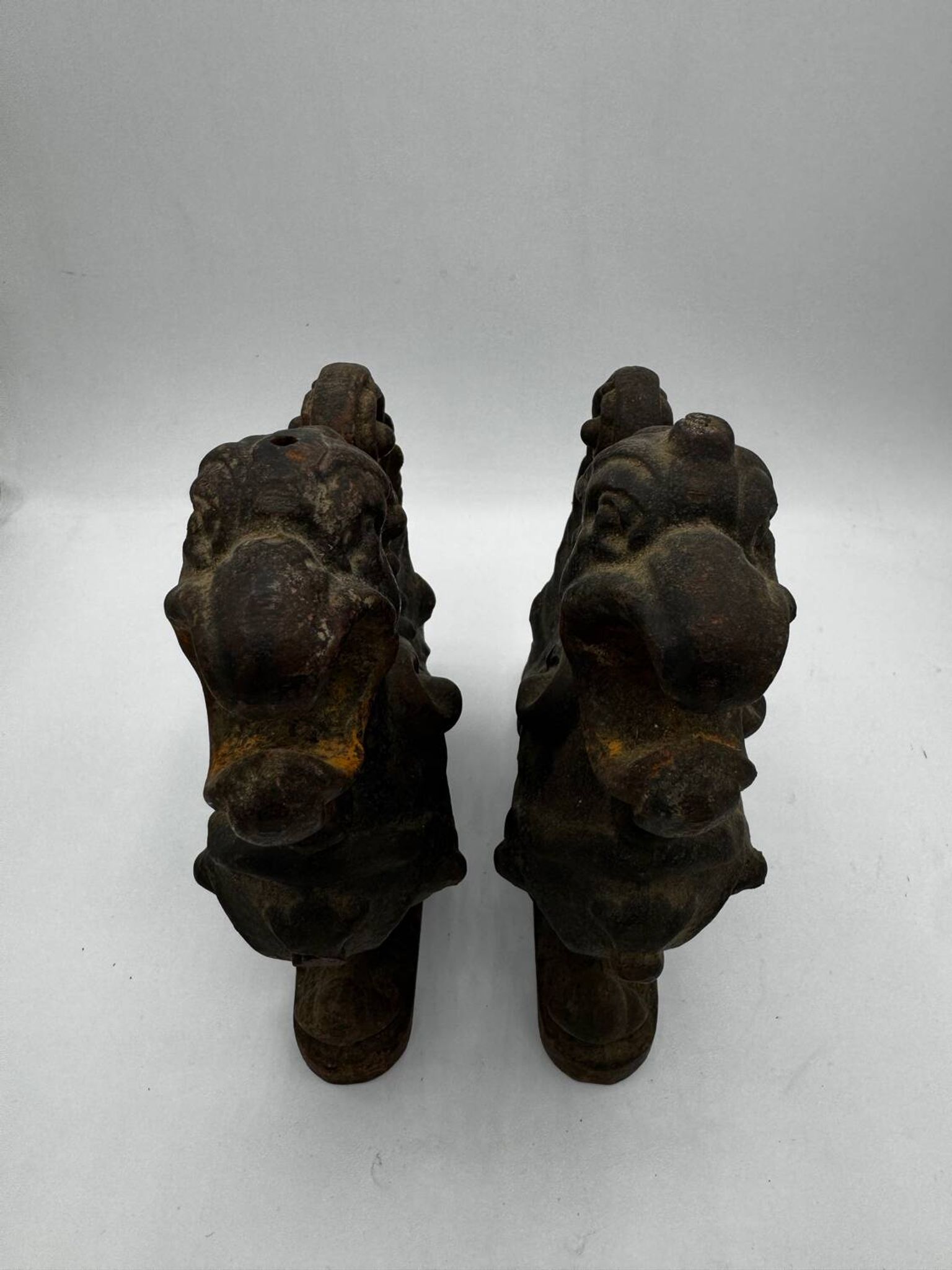 Pair of winged chimera and dragon fire dogs in cast iron