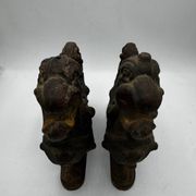 Pair of winged chimera and dragon fire dogs in cast iron