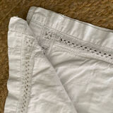 White cotton pillowcase with embroidery and monogram from the 1960s.