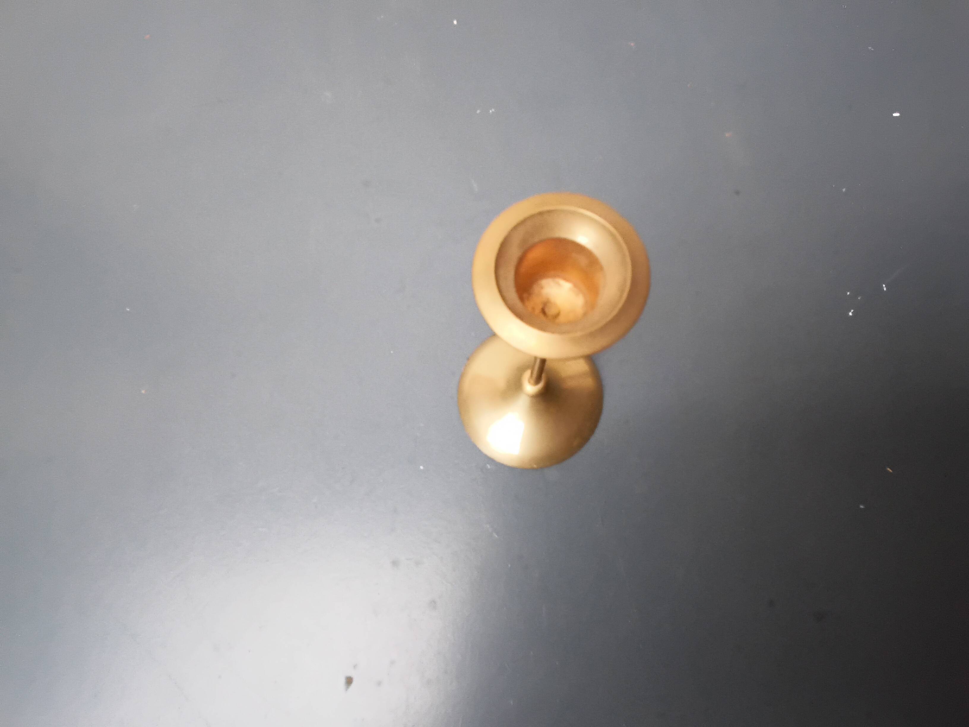 A brass candle holder