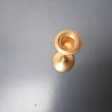 A brass candle holder