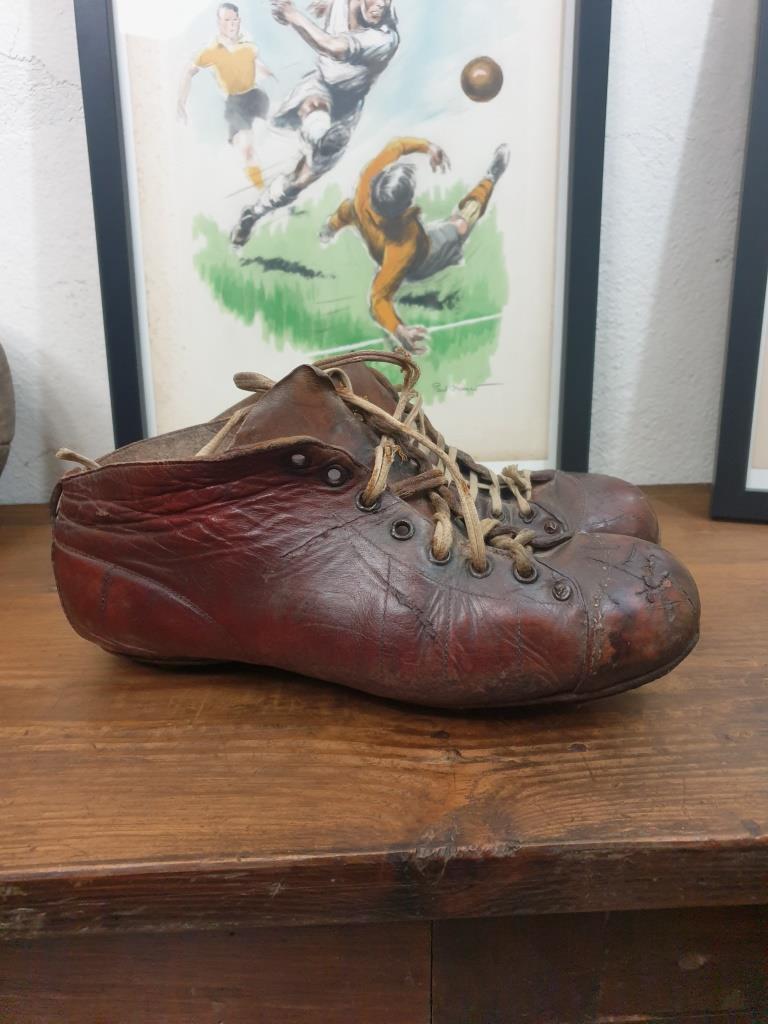 Pair of old football boots, vintage sport