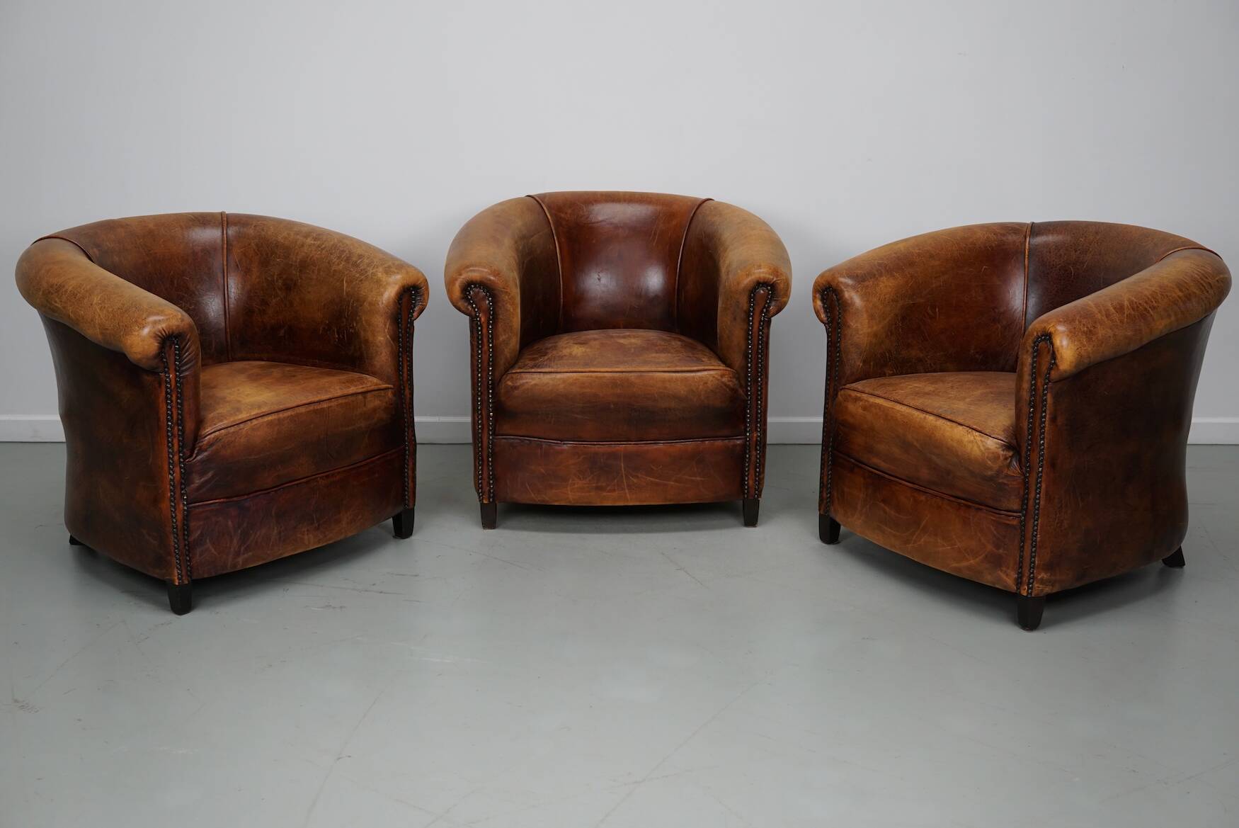Fauteuils club vintage hollandais en cuir cognac, lot de trois