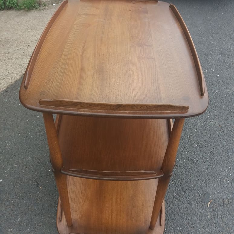 Rolling bar serving table in solid elm by Ercol, England, circa 1960