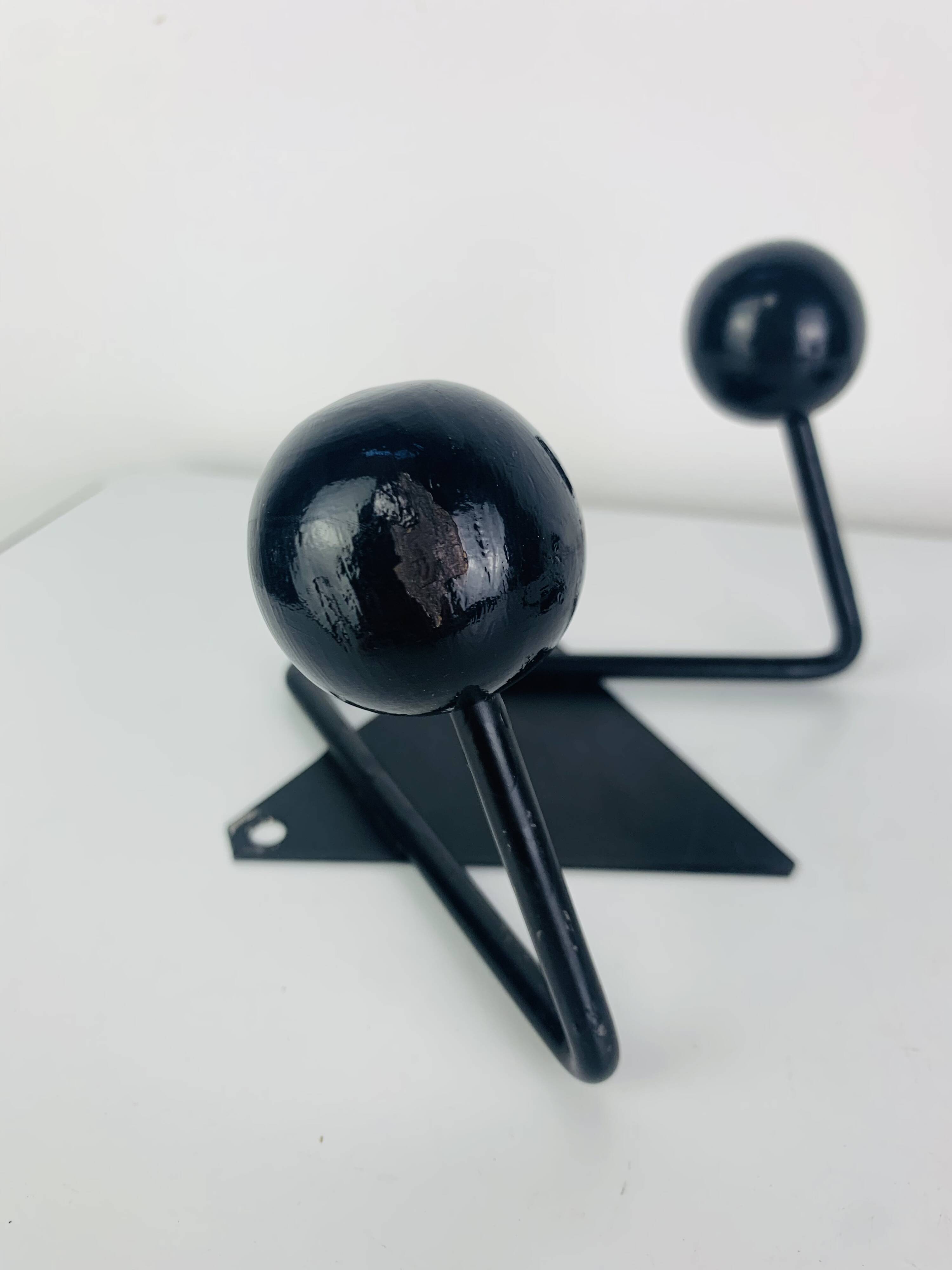 Pair of wall hooks from the 1950s, black metal