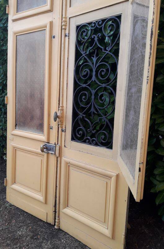 19th century double arched entrance door in oak with grilles and old glass