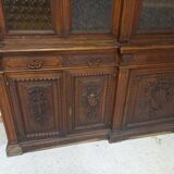 Glass-fronted walnut bookcase