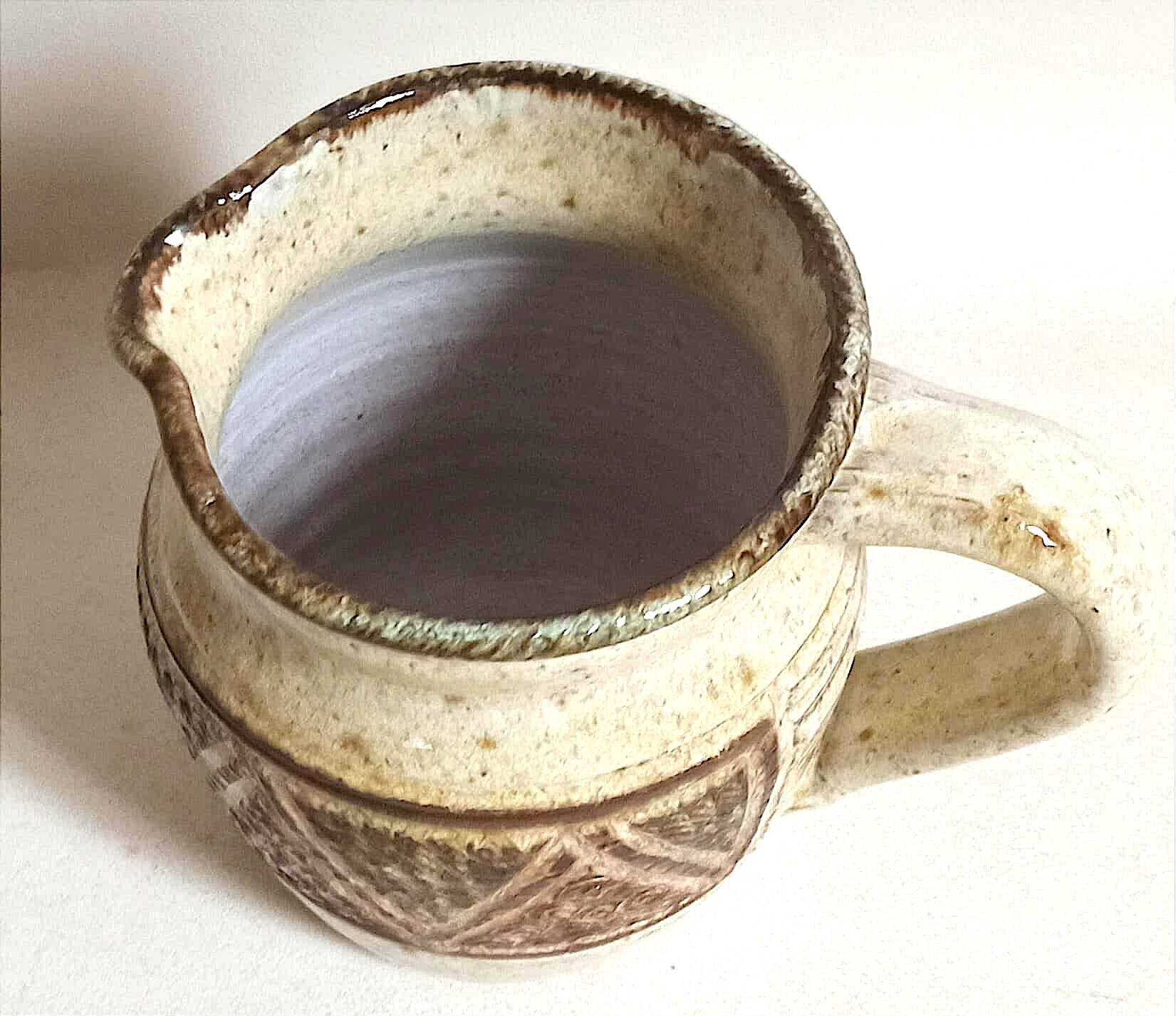 Stoneware pitcher stamped Giraud. Height 18.5 cm