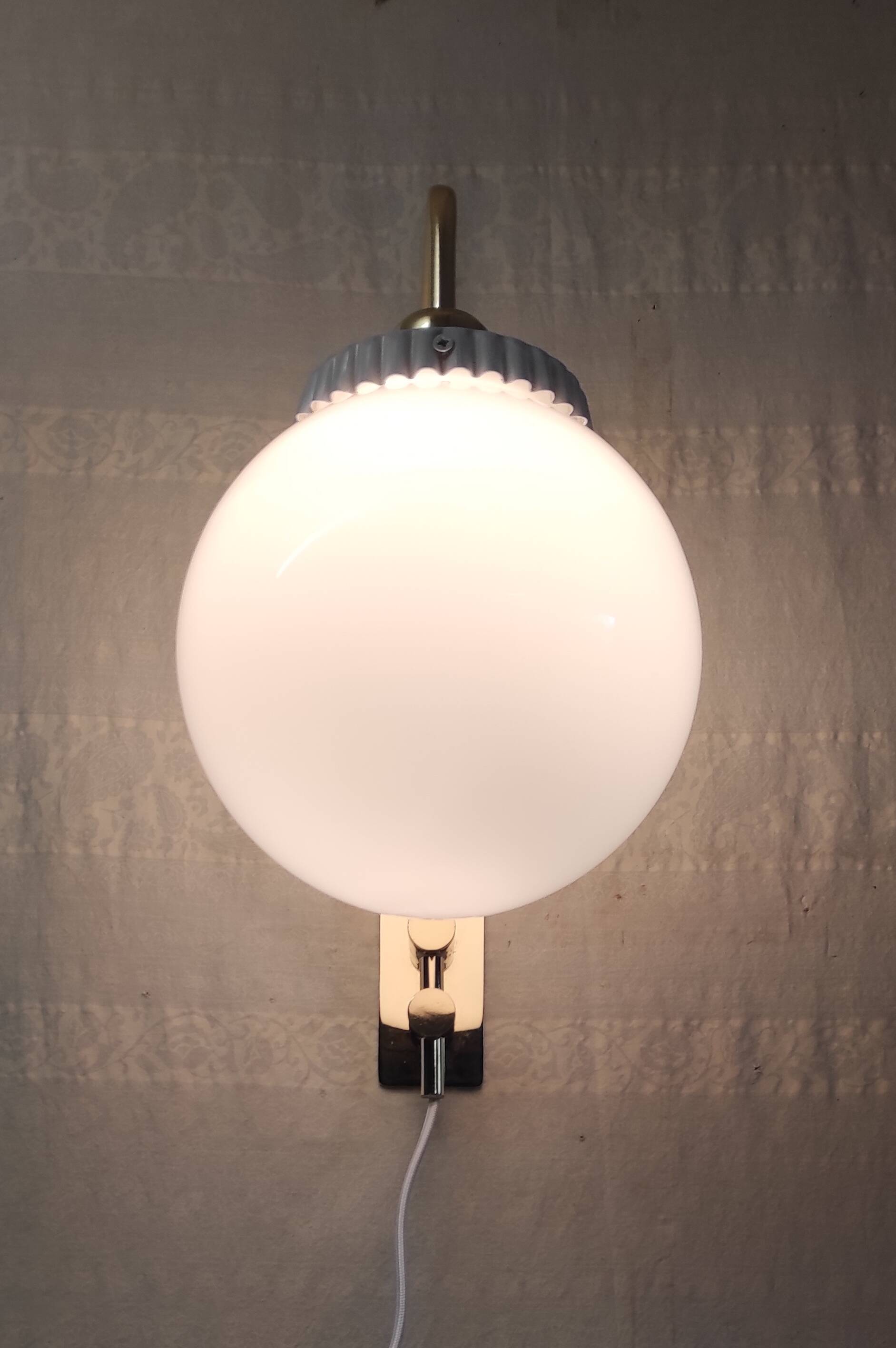 Opaline glass globe wall sconce with a gilt metal bracket - mid-20th century