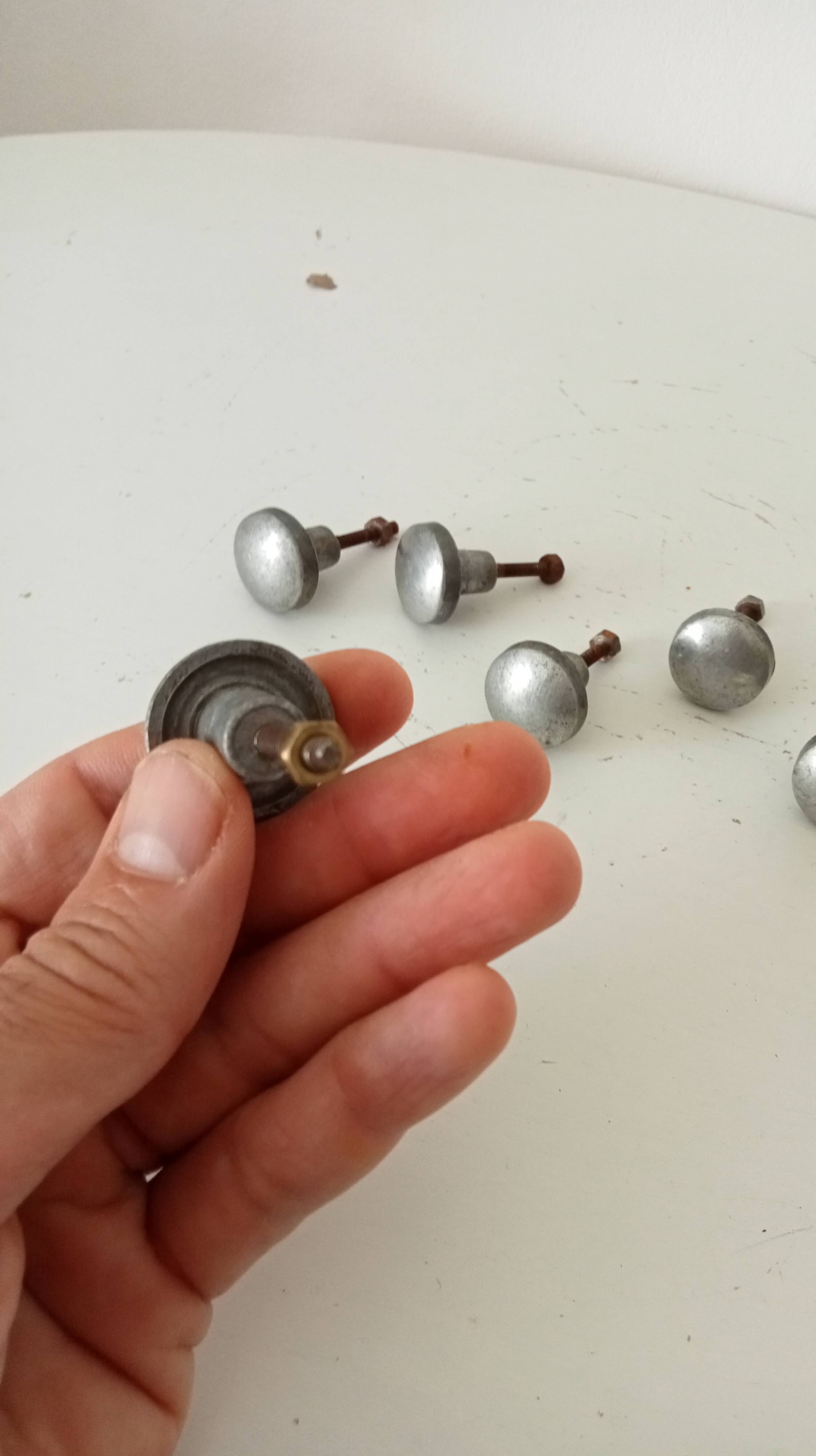 Pair of antique solid aluminium furniture handles.